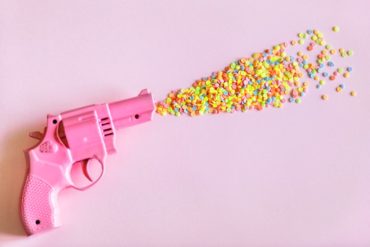 art artsy pink background party gun